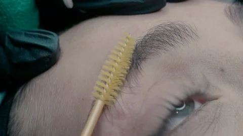 Eyebrow master shows the result of microblading work. Video stock 223154064
