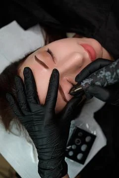 Eyebrow permanent makeup procedure Stock Photos