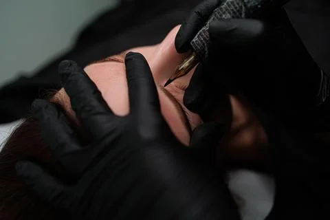 Eyebrow permanent makeup procedure Stock Photos