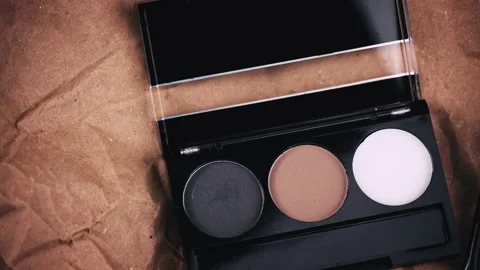 Eyebrow Shadow Swirl on Craft Background Stock Footage 230010985