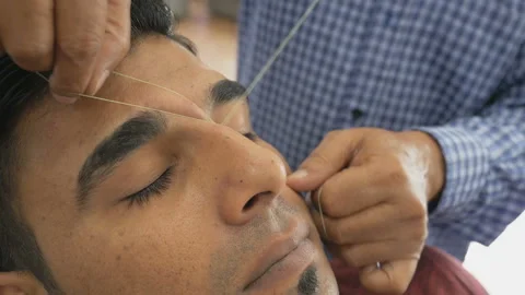 Eyebrows depilation with a thread Stock Footage 114752198