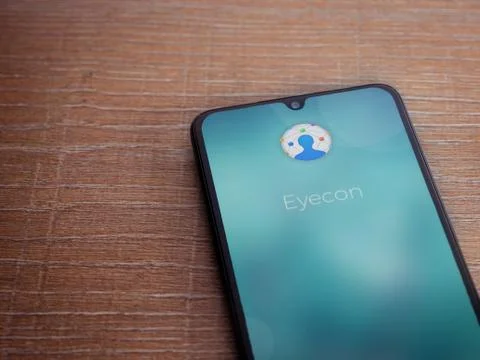 Eyecon app launch screen with logo on the display of a black mobile smartphon Stock Photos
