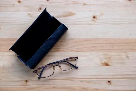 Eyeglass and box Stock Photos