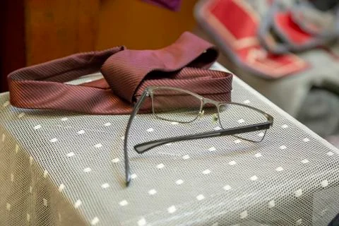 Eyeglass and tie on the lable Stock Photos