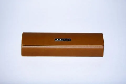 Eyeglass case. brown color, rectangular shape with a shaped lid. On an isolated  Stock Photos