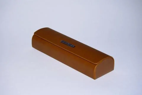 Eyeglass case. brown color, rectangular shape with a shaped lid. On an isolated  Stock Photos