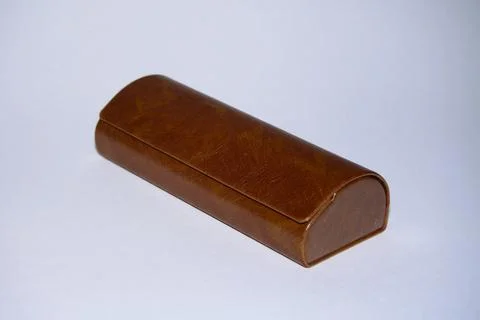Eyeglass case. brown color, rectangular shape with a shaped lid. On an isolated  Stock Photos