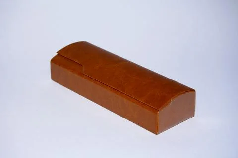 Eyeglass case. brown color, rectangular shape with a shaped lid. On an isolated  Stock Photos
