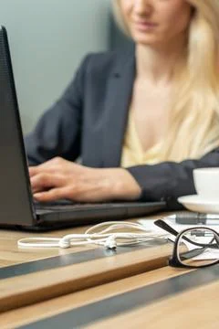 Eyeglass with coffee on office table. Stock Photos