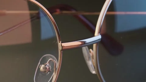 Eyeglasses close-up on grey Stock Footage 140320075