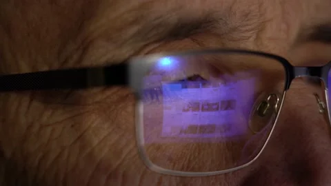 Eyeglasses close-up. A man is browsing the site on the Internet Stock Footage 151461366