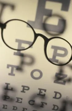 Eyeglasses on an eye chart Foto stock