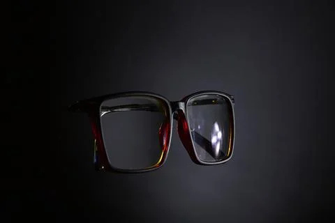 Eyeglasses front view with reflection on dark gradient background Stock Photos