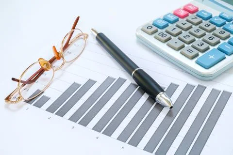 Eyeglasses, pen, chart document and calculator Stock Photos