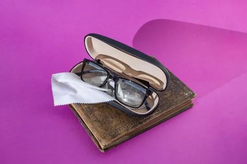 Eyeglasses with rectangular black frame in a opened hard case box with a cl.. Stock Photos
