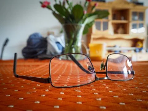 Eyeglasses Resting on a Table Surface Stock Photos