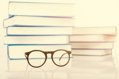 Eyeglasses with stack of book Stock Photos