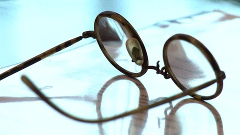 Eyeglasses on a table Video stock 84261574