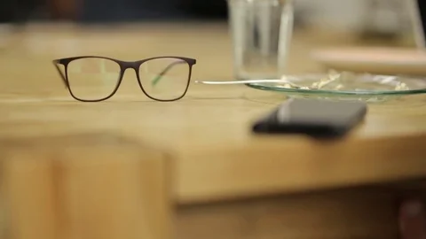 Eyeglasses on the Table Stock Footage 85437200