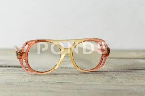 Eyeglasses on wooden table Stock Photos