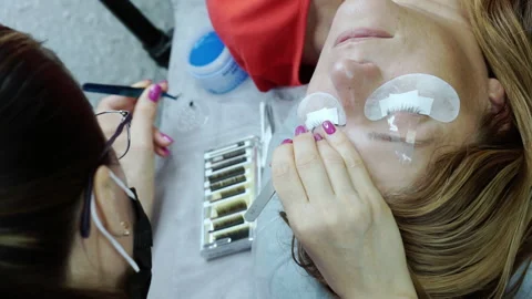 Eyelash extension procedure at the spa. Stock Footage 164056824