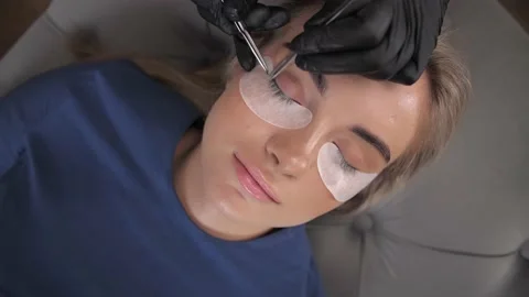Eyelash extension procedure. The working process of professional  Stock Footage 198881255