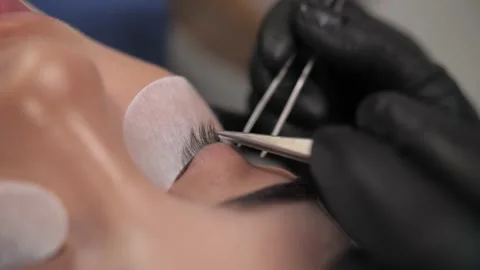 Eyelash extension procedure. The working process of professional Stock Footage 198881269