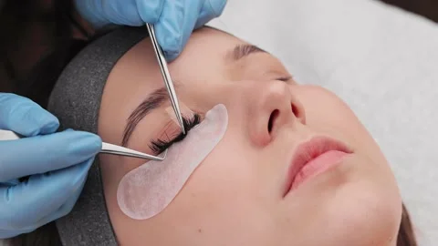 Eyelash extension procedure. The working process of professional beauty master Stock Footage 237463374