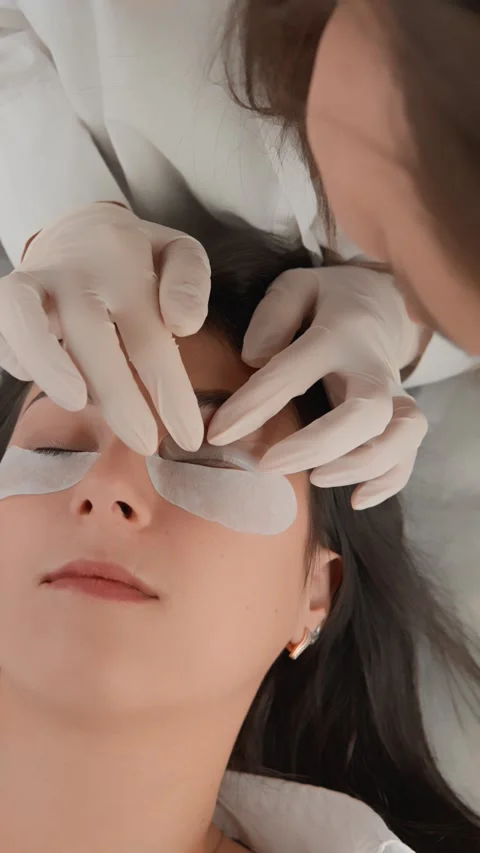 The Eyelash Extension Process includes careful and professional attention to Stock Footage 281152731