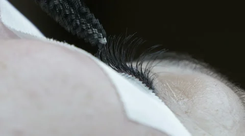 Eyelash extensions, close up, cosmetician working in beauty salon, beautician. Stock Footage 59588353