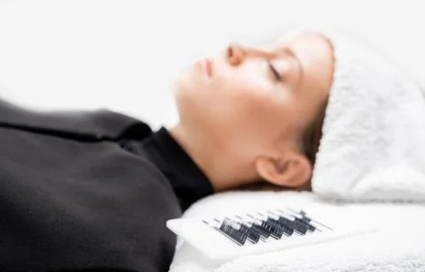 Eyelashes extensions. Lash extension procedure in spa beauty salon 스톡 사진