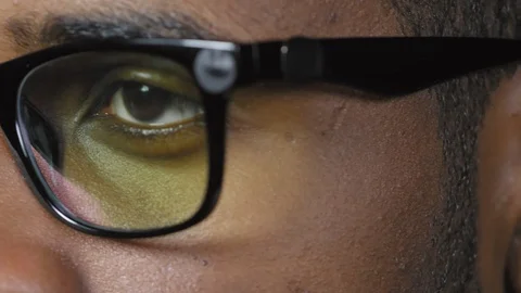 Eyes of Black Man Reading on Computer Video stock 103525973