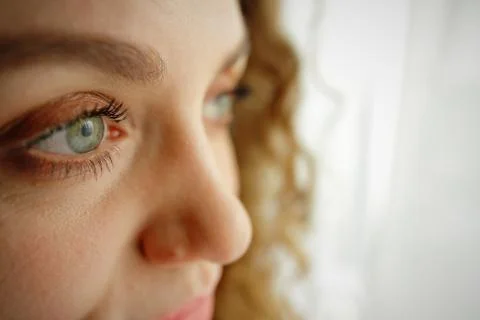 Eyes close up of a beautiful curly girl Stock Photos