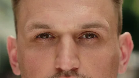Eyes close up dark iris human eye open Caucasian man cropped view eyesight guy Stock Footage 310308571
