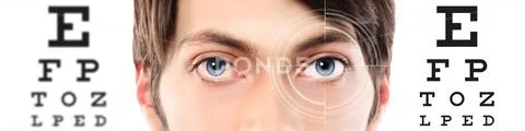 Photograph: Eyes close up on visual test chart, eyesight and eye ...