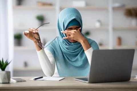 Eyes Fatigue. Stressed Black Muslim Freelancer Lady Tired After Working On Stock Photos