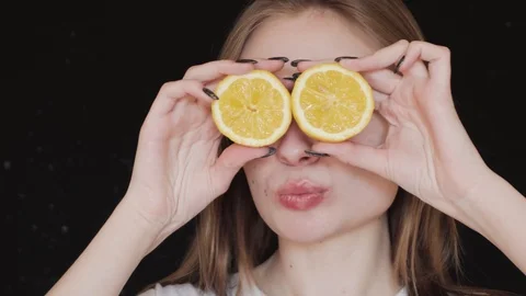 Eyes of lemons. Cheerful and beautiful girl. 4k Stock Footage 88872853