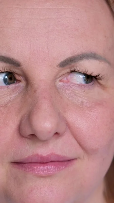 Eyes move from side to side, closeup. Woman brown eyes look from right to left Stock Footage 309452633