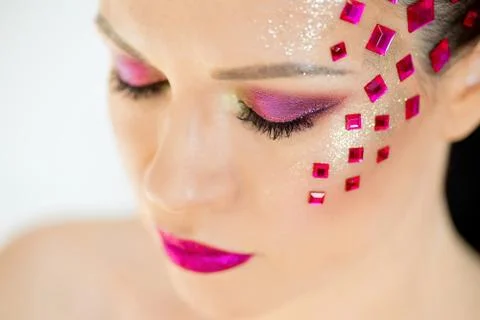 Eyes painted sequins closeup Stock Photos