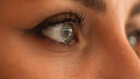 Eyes reflecting PC screen while surf online, work late, browsing online at .. Stock Photos