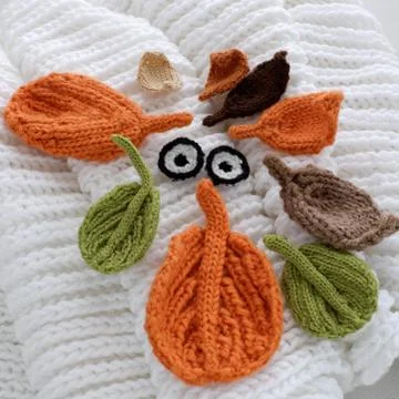 Eyes of winter, simple background from knitted leaf Stock Photos