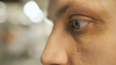 Eyes of the young man closeup side view Video stock 75413577