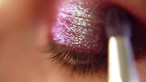 Eyeshadow applying - makeup for eyes closeup. Fashion and beauty make-up Stock Footage