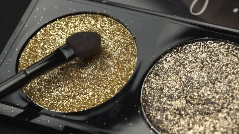 Eyeshadow Palette. Apply eye shadow on the brush. Close-up. Stock Footage 122200069