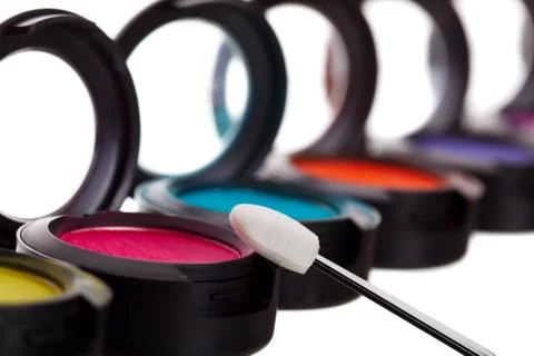 Eyeshadow pots with brush Stock Photos