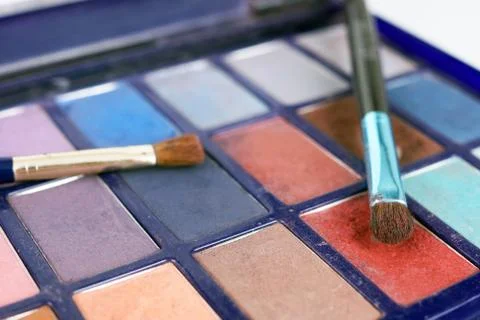 Eyeshadows and brushes Stock Photos