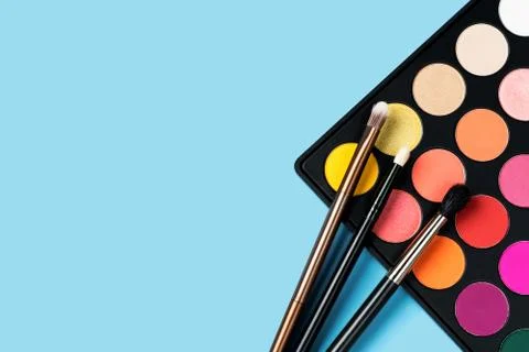 Eyeshadows on blue background Foto stock