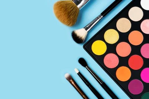 Eyeshadows on blue background Stock Photos