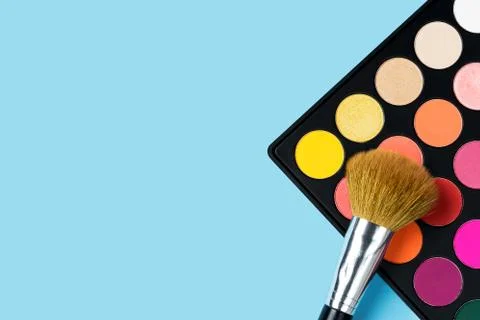 Eyeshadows on blue background Stock Photos