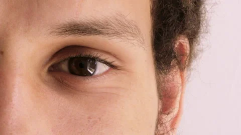 Eyesight, optometry and face of man in studio with vision, optical health or Video stock 334708134
